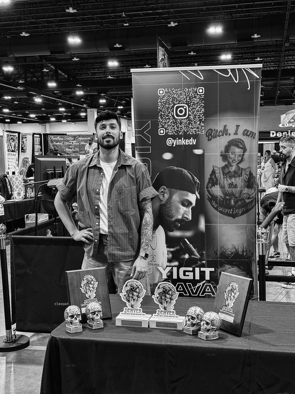 Yigit Savas at his booth with his awards